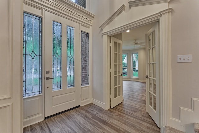 62 N Turtle Rock Ct, The Woodlands, TX 77381 - foyer entrance featuring french doors, wood finished floors, and a ceiling fan