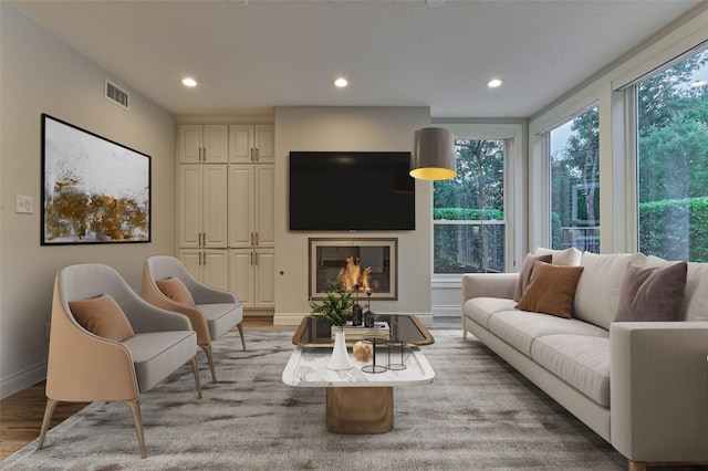 62 N Turtle Rock Ct, The Woodlands, TX 77381 - living area with wood finished floors and recessed lighting