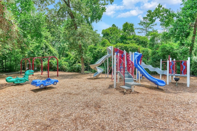 62 N Turtle Rock Ct, The Woodlands, TX 77381 - communal playground with view of scattered trees