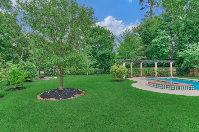 62 N Turtle Rock Ct, The Woodlands, TX 77381 - view of yard featuring a pool with connected hot tub