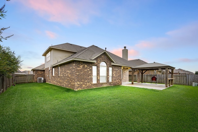 23414 Bracino Lake Dr, Katy, TX 77493 - rear view of property with a gazebo, a patio, brick siding, and a fenced backyard