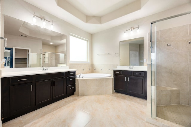 23414 Bracino Lake Dr, Katy, TX 77493 - full bath featuring a tray ceiling, a stall shower, two vanities, and tile patterned floors