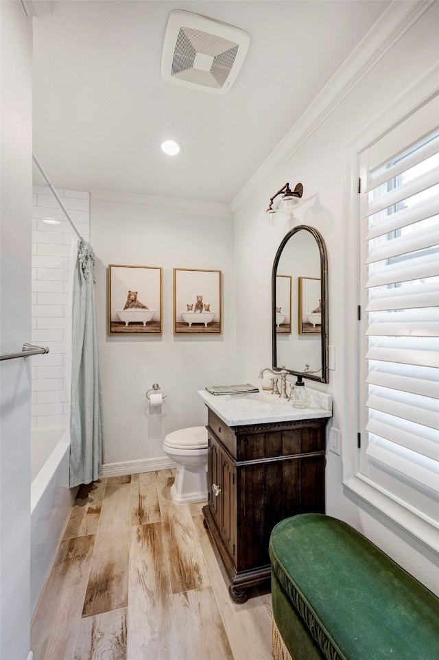 3739 University Blvd, Southside Place, TX 77005 - bathroom with crown molding, vanity, wood finished floors, shower / bath combination with curtain, and recessed lighting