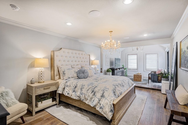 3739 University Blvd, Southside Place, TX 77005 - bedroom with a chandelier, ornamental molding, wood finished floors, and recessed lighting