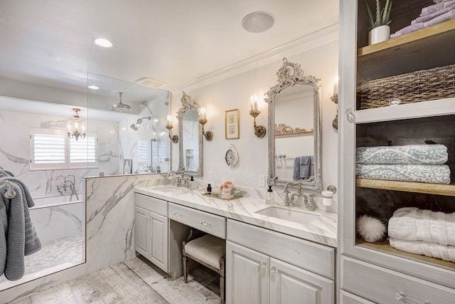 3739 University Blvd, Southside Place, TX 77005 - bathroom featuring a marble finish shower, double vanity, a chandelier, and crown molding
