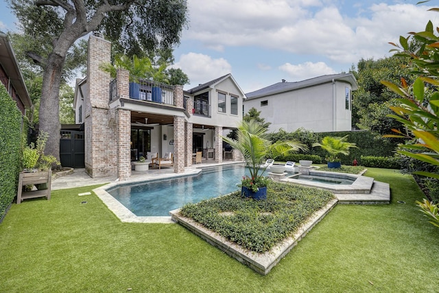 3739 University Blvd, Southside Place, TX 77005 - rear view of property featuring a balcony, an in-ground hot tub, a lawn, a patio, and an outdoor pool
