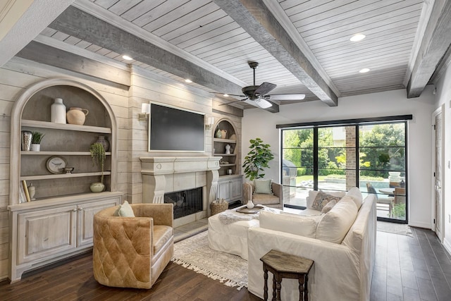 3739 University Blvd, Southside Place, TX 77005 - living room with dark wood-type flooring, a tile fireplace, built in shelves, a wooden ceiling with exposed beams, and recessed lighting