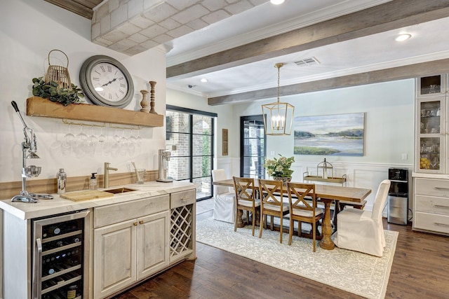 3739 University Blvd, Southside Place, TX 77005 - kitchen featuring beverage cooler, crown molding, dark wood-style flooring, beamed ceiling, and a chandelier
