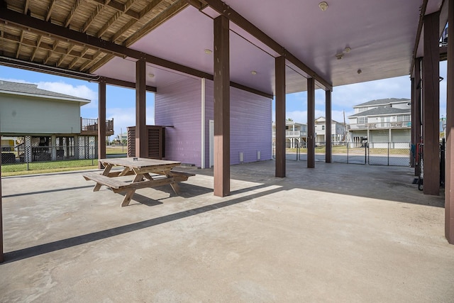 23101 Camino St, Galveston, TX 77554 - view of patio / terrace with a carport and a residential view