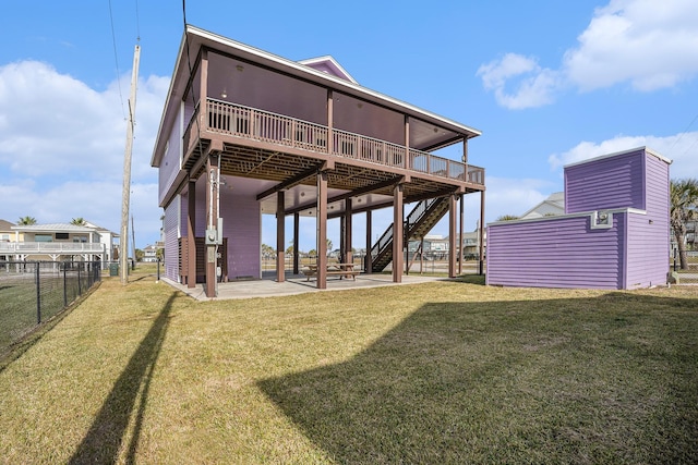 23101 Camino St, Galveston, TX 77554 - rear view of property with a patio, stairs, and a wooden deck