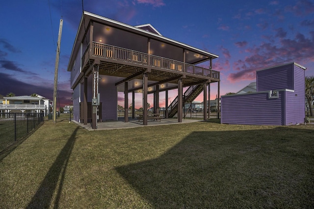 23101 Camino St, Galveston, TX 77554 - rear view of house featuring a patio area, a deck, stairs, and an outdoor structure