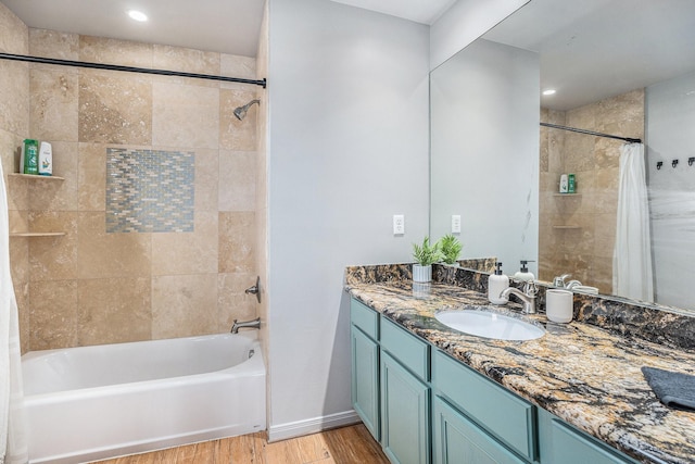 23101 Camino St, Galveston, TX 77554 - bathroom featuring wood finished floors, shower / bath combination with curtain, vanity, and recessed lighting