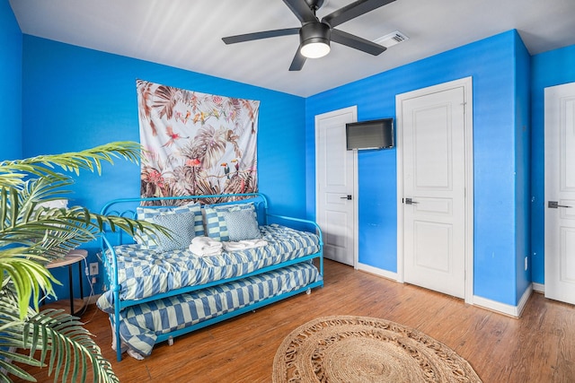 23101 Camino St, Galveston, TX 77554 - bedroom featuring wood finished floors, vaulted ceiling, and a ceiling fan