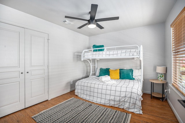 23101 Camino St, Galveston, TX 77554 - bedroom with wood finished floors, a closet, and ceiling fan