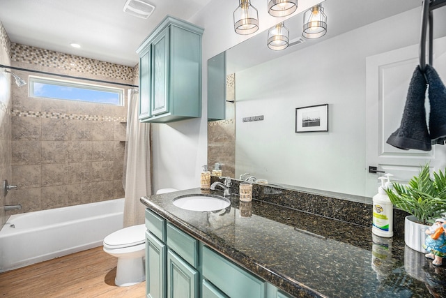 23101 Camino St, Galveston, TX 77554 - bathroom with shower / tub combo with curtain, vanity, and wood finished floors