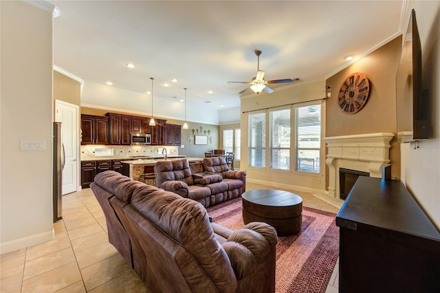 19723 Alton Springs Dr, Cypress, TX 77433 - living area with light tile patterned flooring, a ceiling fan, crown molding, a glass covered fireplace, and recessed lighting