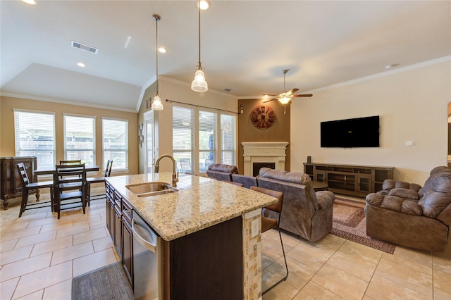 19723 Alton Springs Dr, Cypress, TX 77433 - kitchen with stainless steel dishwasher, open floor plan, a ceiling fan, light tile patterned floors, and crown molding
