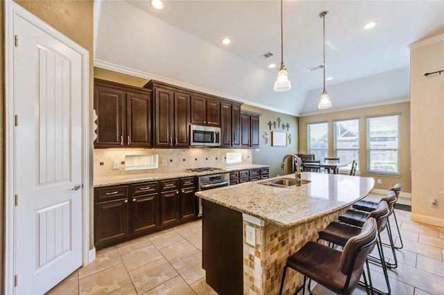 19723 Alton Springs Dr, Cypress, TX 77433 - kitchen with stainless steel appliances, lofted ceiling, light tile patterned floors, backsplash, and a breakfast bar area