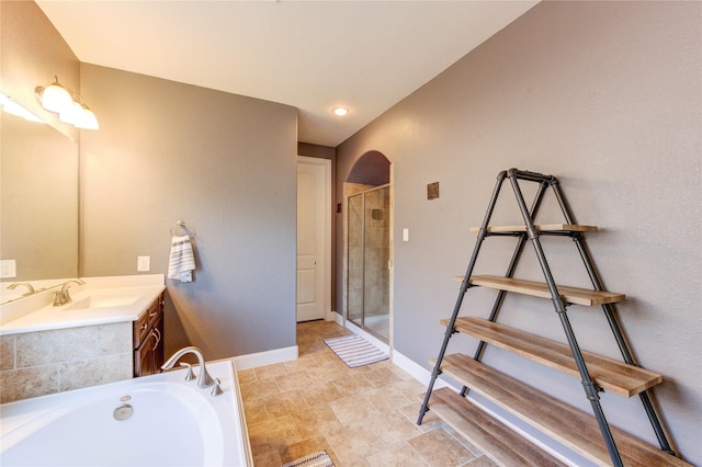 19723 Alton Springs Dr, Cypress, TX 77433 - bathroom with vanity, a shower stall, and a garden tub