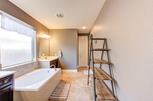 19723 Alton Springs Dr, Cypress, TX 77433 - bathroom featuring vanity and a garden tub