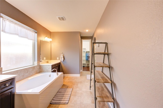 19723 Alton Springs Dr, Cypress, TX 77433 - full bathroom featuring vanity and a garden tub