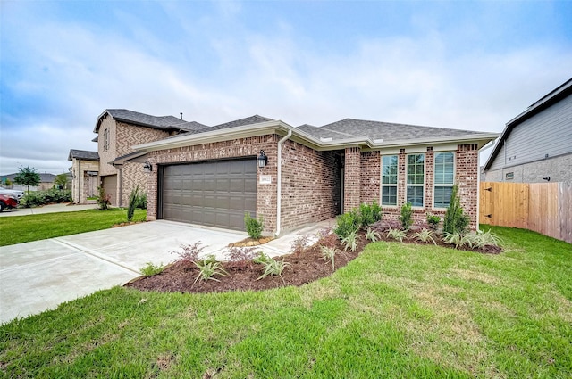 18822 Fulvetta Haven Way, Richmond, TX 77407 - view of front of house with an attached garage, brick siding, concrete driveway, and a shingled roof