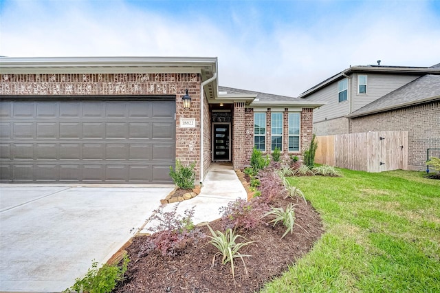 18822 Fulvetta Haven Way, Richmond, TX 77407 - view of front of house featuring brick siding, driveway, and an attached garage