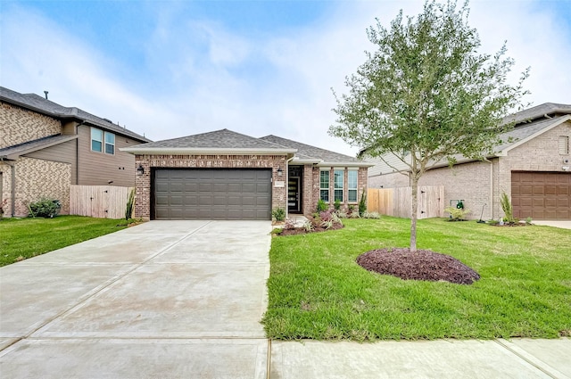 18822 Fulvetta Haven Way, Richmond, TX 77407 - view of front of home with brick siding, driveway, an attached garage, and a shingled roof
