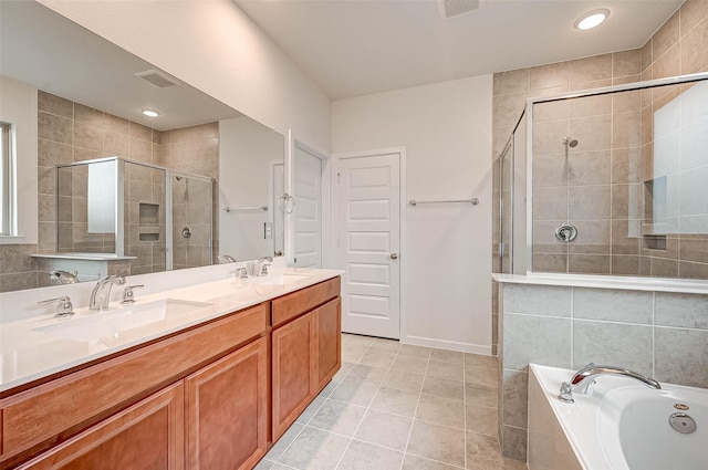 18822 Fulvetta Haven Way, Richmond, TX 77407 - bathroom featuring a garden tub, a shower stall, double vanity, tile patterned floors, and recessed lighting