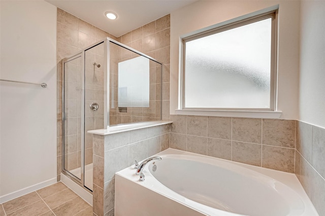 18822 Fulvetta Haven Way, Richmond, TX 77407 - full bath featuring a garden tub, a shower stall, and tile patterned floors