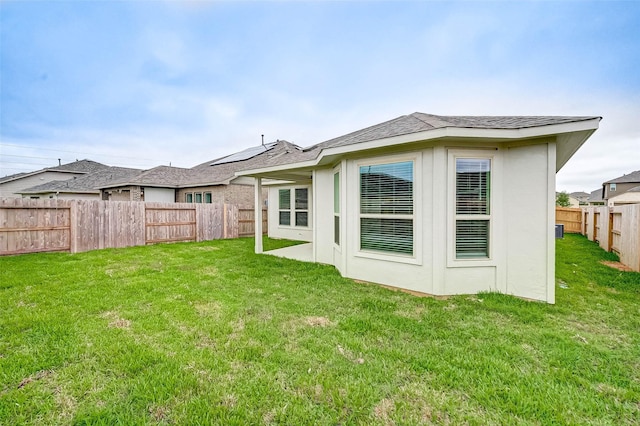 18822 Fulvetta Haven Way, Richmond, TX 77407 - back of house with a fenced backyard and roof with shingles