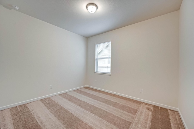18822 Fulvetta Haven Way, Richmond, TX 77407 - spare room with light carpet and a smoke detector