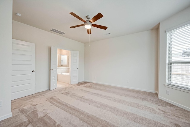 18822 Fulvetta Haven Way, Richmond, TX 77407 - unfurnished bedroom with light carpet, ensuite bath, and ceiling fan