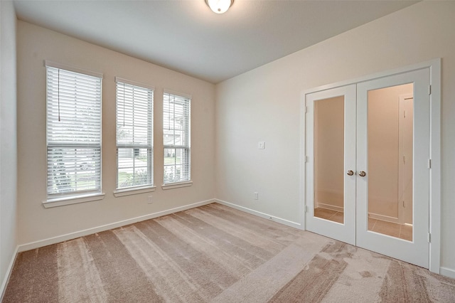 18822 Fulvetta Haven Way, Richmond, TX 77407 - unfurnished room with french doors and carpet flooring