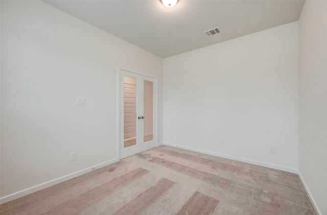 18822 Fulvetta Haven Way, Richmond, TX 77407 - unfurnished room with light carpet and french doors
