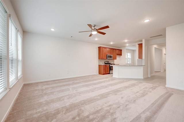 18822 Fulvetta Haven Way, Richmond, TX 77407 - unfurnished living room with recessed lighting, light carpet, and a ceiling fan