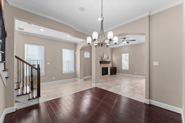127 Benjis Pl, The Woodlands, TX 77380 - foyer featuring arched walkways, a ceiling fan, crown molding, healthy amount of natural light, and stairway