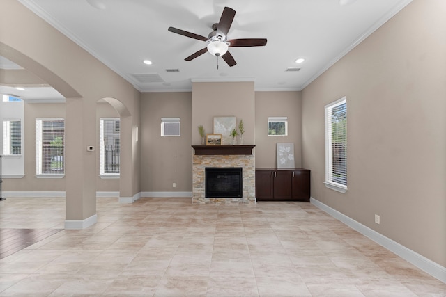127 Benjis Pl, The Woodlands, TX 77380 - living area with a ceiling fan, arched walkways, crown molding, a fireplace, and recessed lighting