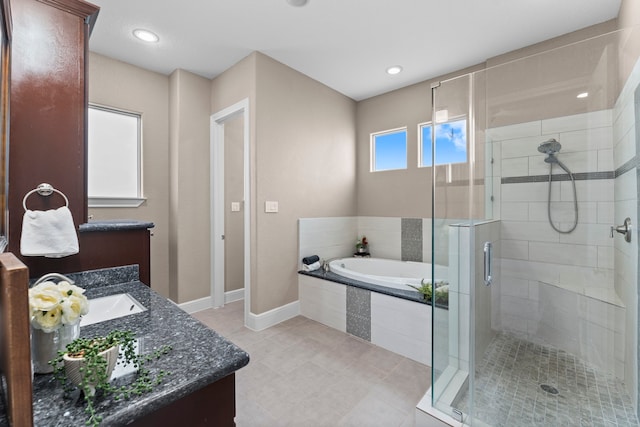 127 Benjis Pl, The Woodlands, TX 77380 - full bathroom featuring vanity, a bath, a stall shower, and tile patterned flooring