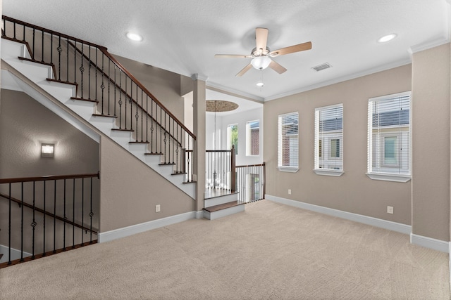 127 Benjis Pl, The Woodlands, TX 77380 - unfurnished living room featuring ceiling fan, carpet, ornamental molding, recessed lighting, and decorative columns