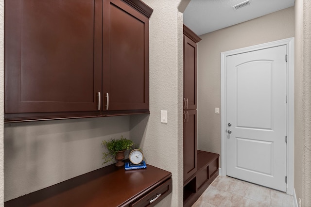 127 Benjis Pl, The Woodlands, TX 77380 - mudroom featuring a textured wall