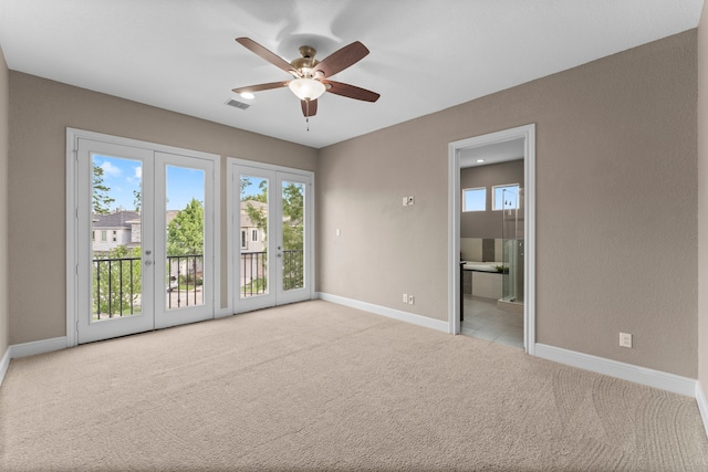 127 Benjis Pl, The Woodlands, TX 77380 - spare room featuring carpet flooring, healthy amount of natural light, and a ceiling fan