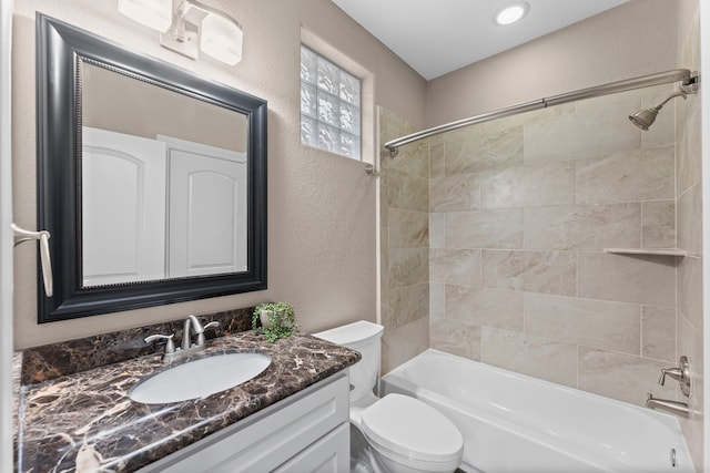 127 Benjis Pl, The Woodlands, TX 77380 - bathroom with a textured wall, tub / shower combination, and vanity