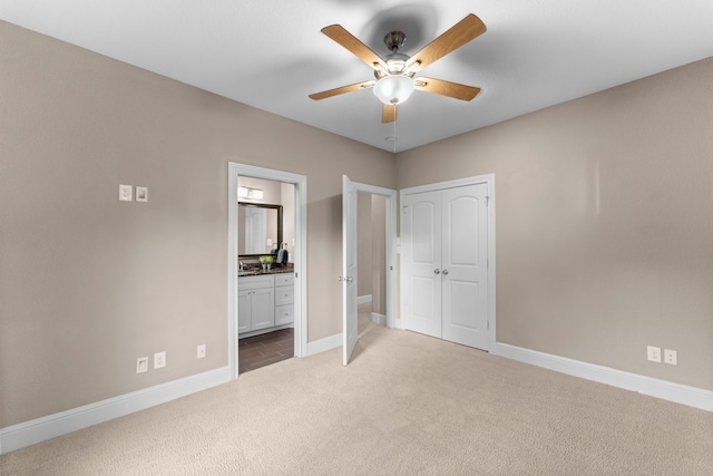 127 Benjis Pl, The Woodlands, TX 77380 - unfurnished bedroom with carpet floors, a closet, connected bathroom, and ceiling fan