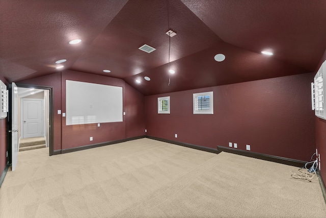 127 Benjis Pl, The Woodlands, TX 77380 - home theater with carpet flooring, lofted ceiling, a textured ceiling, and recessed lighting