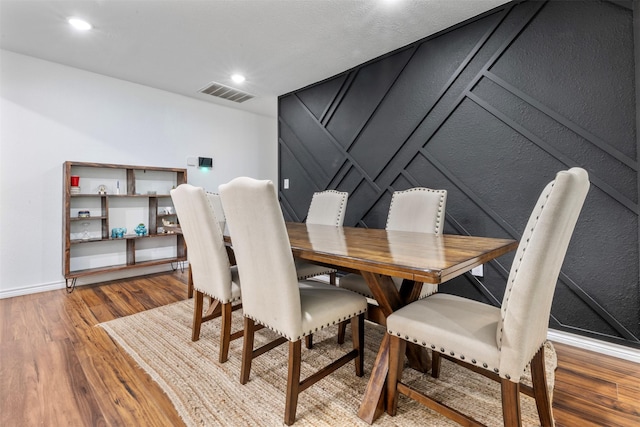 5413 Bataan Rd, Houston, TX 77033 - dining area with wood finished floors and recessed lighting