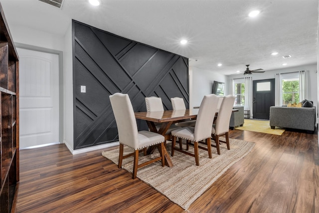 5413 Bataan Rd, Houston, TX 77033 - dining space featuring wood finished floors, recessed lighting, a decorative wall, and ceiling fan