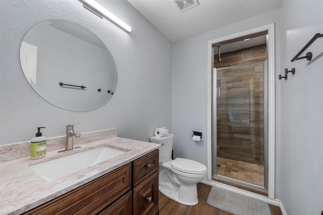 5413 Bataan Rd, Houston, TX 77033 - full bathroom featuring vanity, a stall shower, and wood finished floors