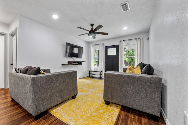 5413 Bataan Rd, Houston, TX 77033 - living area featuring wood finished floors, ceiling fan, a textured ceiling, a textured wall, and recessed lighting