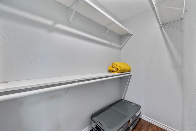 5413 Bataan Rd, Houston, TX 77033 - spacious closet with dark wood-style floors